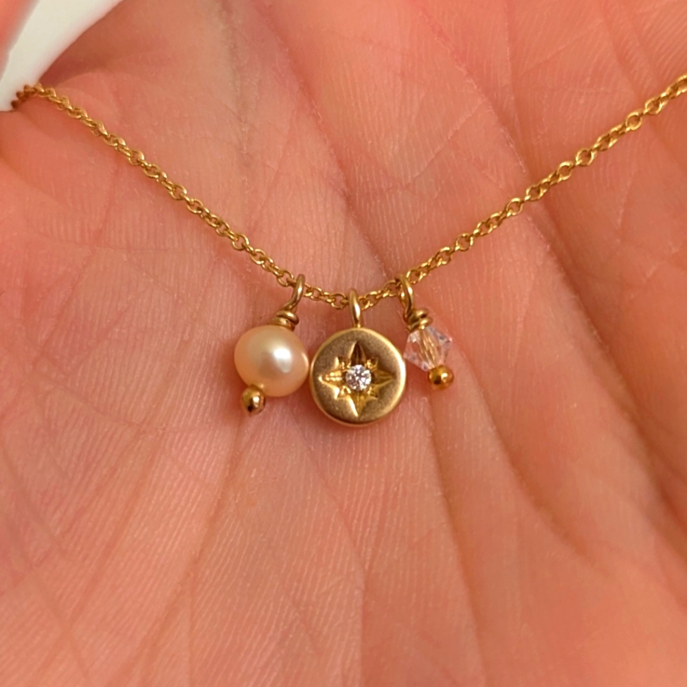 Gold North Star charm necklace
